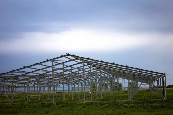 The building of the new base for cows. Steel structure of the future truss. High quality photo