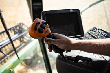 View from the combine cabin, harvesting. High quality photo