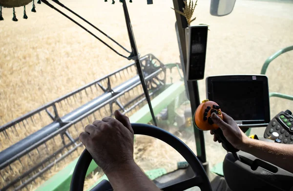 View from the combine cabin, harvesting. High quality photo