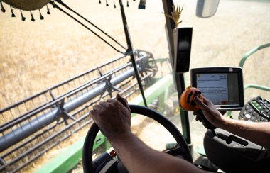 View from the combine cabin, harvesting. High quality photo
