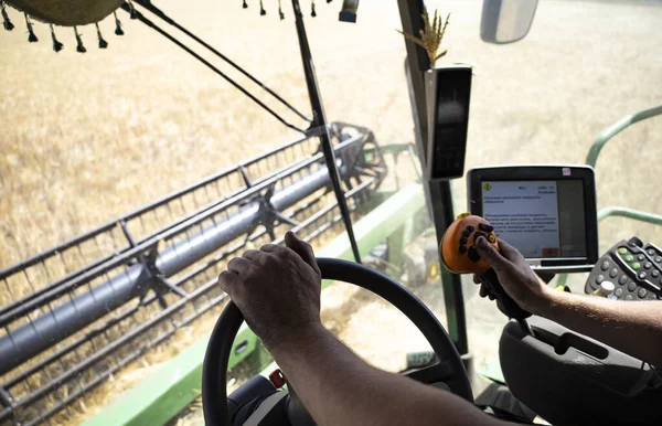 View from the combine cabin, harvesting. High quality photo