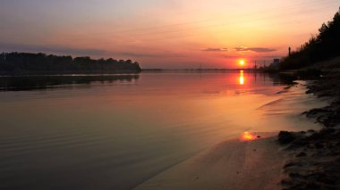 Beautiful summer sunset on the river. Nature landscape.