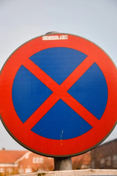 Closeup of a round street or road sign in traffic