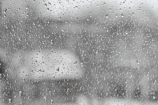 Full frame photo of water drops after rain on a window