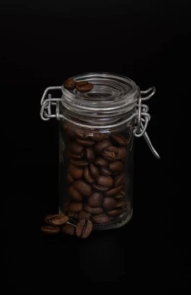 Studio Photo Brown Coffee Beans Glass Jar Black Background — Stok fotoğraf