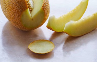   sliced yellow melon on the table