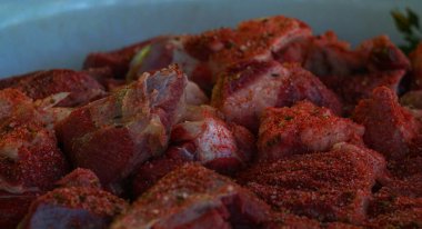                        Cumin is sprinkled on the meat and ground        