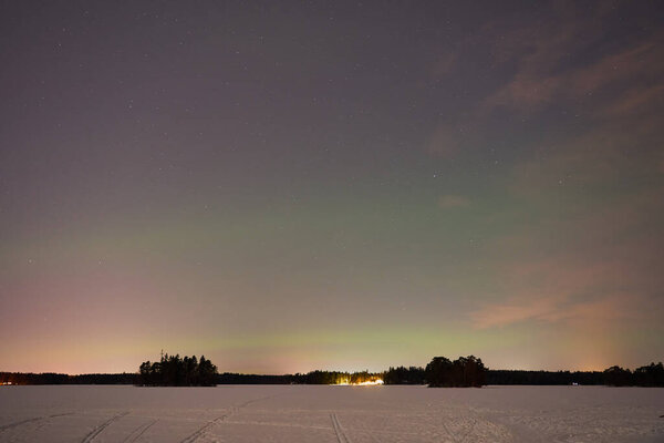The Northern Lights on a lake in Finland.