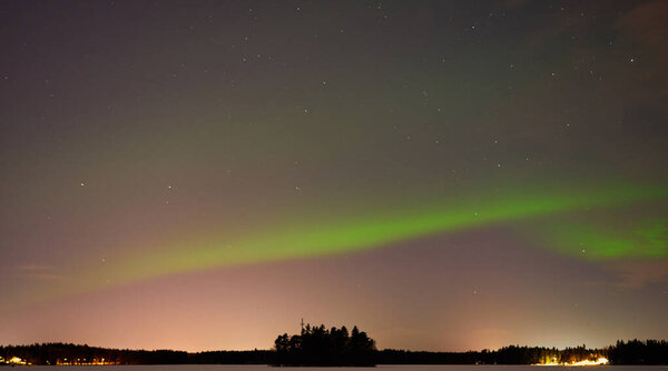 The Northern Lights on a lake in Finland.