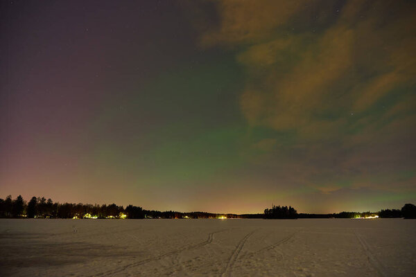 The Northern Lights on a lake in Finland.