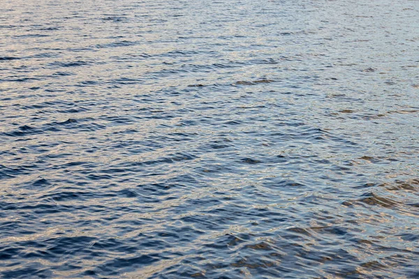 The turbulent surface of the water on the lake as a background