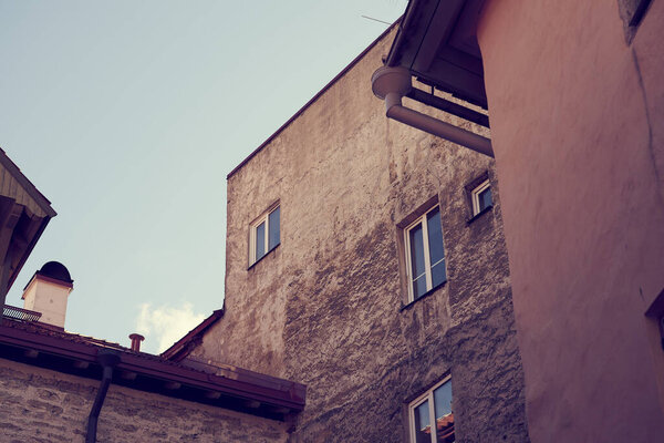 Walls and roofs of old medieval houses in the old town in Tallinn, Estonia