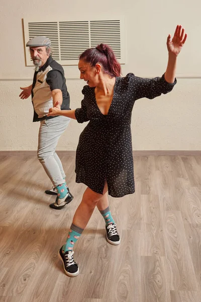 Lindy Hop teacher couple in a ballroom Royalty Free Stock Photos
