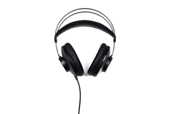 Black headphones isolated on a white background. Top view. — Stock Photo, Image