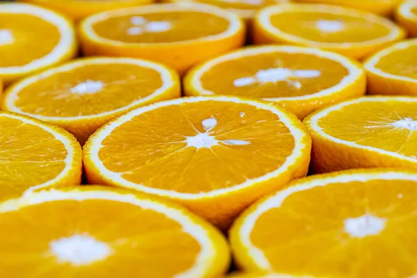 Lots of citrus fruits cut in half to make juice close-up,