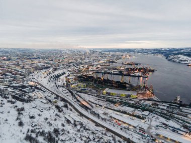 Beautiful aerial air winter vibrant view of Murmansk, Russia, a port city and the administrative center of Murmansk Oblast, Kola peninsula, Kola Bay. Northern Sea Route clipart
