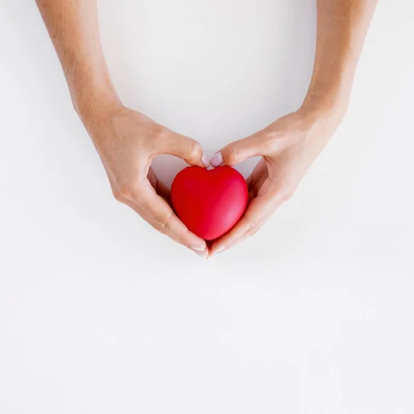 Top view hands holding heart shape world heart day. High quality beautiful photo concept — Stock Photo, Image