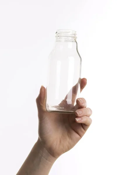 Håndholdt glassflaske. Vakkert bildebegrep av høy kvalitet – stockfoto