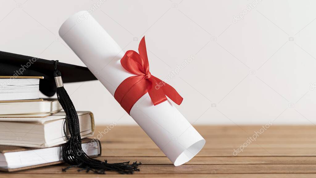 certificate with ribbon bow books. High quality beautiful photo concept