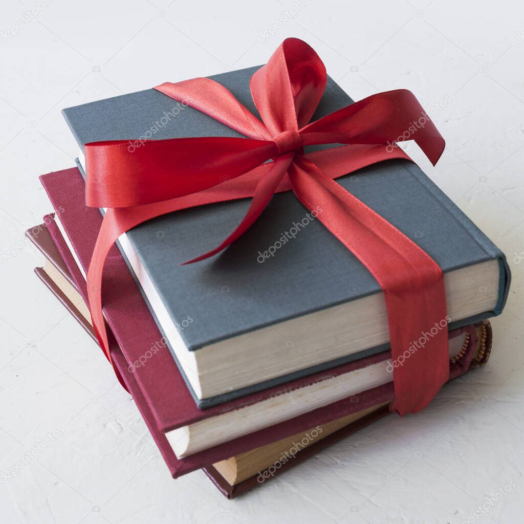 books with red ribbon. High quality beautiful photo concept