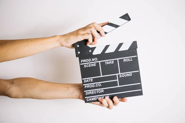 Beskära händer med clapperboard 2. Hög kvalitet vacker foto koncept — Stockfoto