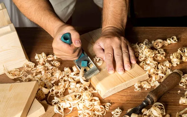 Carpenter working with his bare hands wood. High quality photo Stock Photo