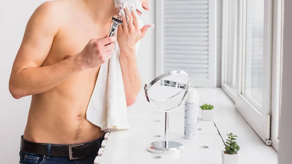 Shaving concept with attractive young man. High quality photo — Stock Photo, Image