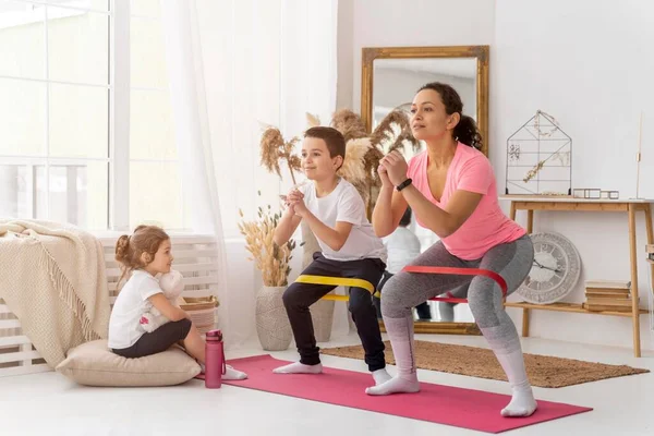 Kids adult training with resistance band. High quality photo — Stock Photo, Image