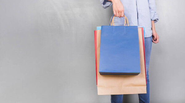 human holding shopping packages. High quality photo