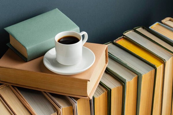 creative arrangement with different books coffee. High quality photo