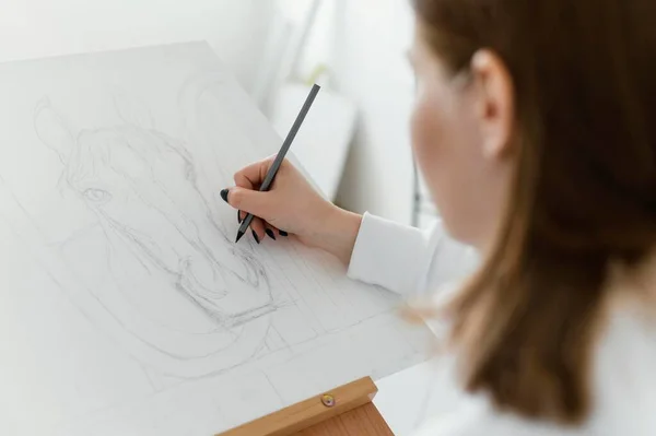 young woman drawing canvas. High resolution photo