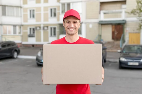 smiley guy delivering package. High resolution photo