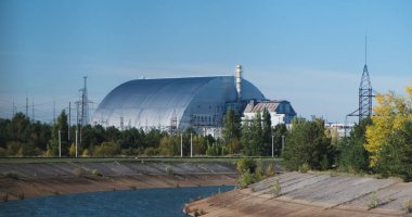 Sarcophagus Chernobyl, fourth reactor, shelter. Metal hangar, view from a moving bus on a tour. High quality 4k footage clipart