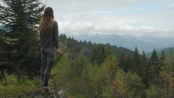 Long Red Haired Young Woman Standing Peak Overlooking Mountains Green — Stock video