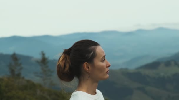 Face Young Woman Side View Stands Mountains Looks Distance Clouds — Stockvideo