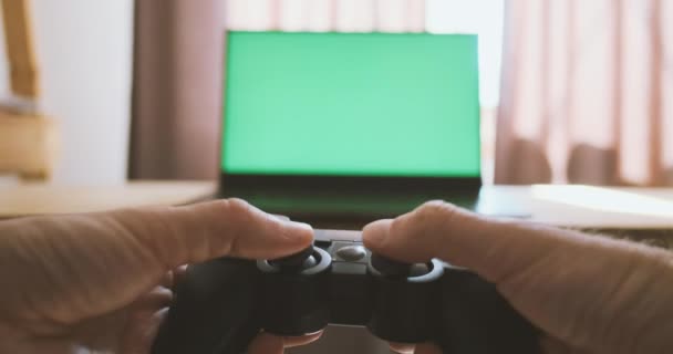 Gamepad Hands Playing Console Background Green Monitor Male Hands Hold — Vídeo de Stock