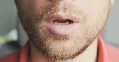 Face of an unshaven man exhales air through his mouth. Close-up, portrait, unrecognizable. Calm concept, breathing practice, nerves, health, relaxation. High quality 4k footage