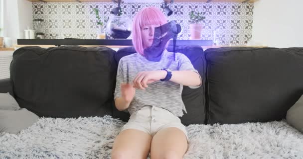 Young Girl Chooses Shoes Hologram Smart Watch Online Shopping Sitting — Vídeos de Stock