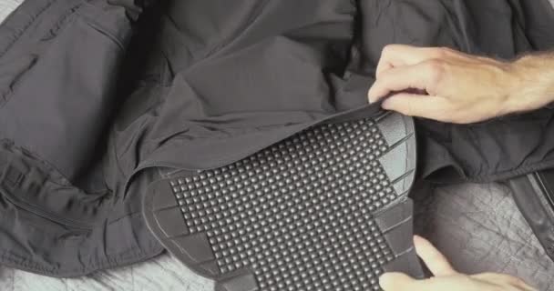 Hands Place Plastic Motorcycle Back Protector Motorcycle Jacket Fasten Zipper — Vídeos de Stock