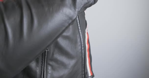 Motorcyclist Unzip Black Moto Jacket Close Side View Chest Indoors — Wideo stockowe