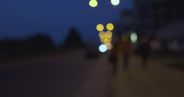 Night City Street Blurry Road Moving Cars Pedestrians Walk Sidewalk — Stockvideo