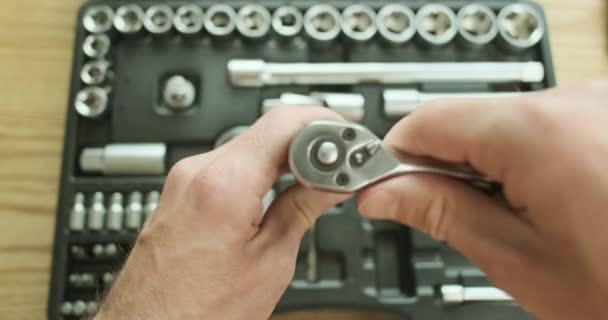 Man Takes Ratchet Connects Screwdriver Demonstration Work Background Set Tools — Vídeo de Stock