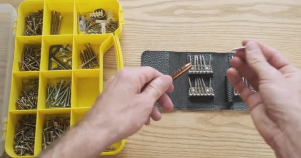 Male Hands Take Bit Out Screwdriver Put Case Close Plastic — Vídeo de Stock