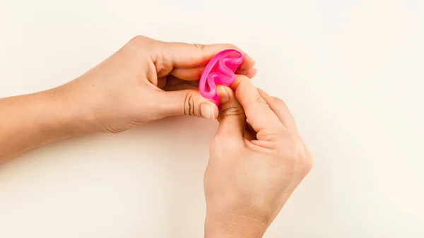Female Hand Holding Pink Menstrual Cup Folded Fold Method Folding — Foto de Stock