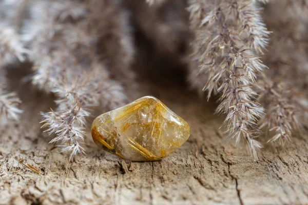 Rutilated Quartz Mineral Stone Close Wooden Background Golden Rutile Inclusions — Stockfoto