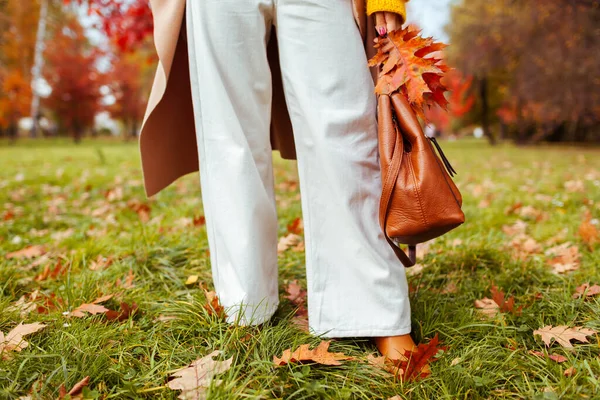 Fashionable Woman Wearing Stylish White Flared Trendy Pants Holding Handbag — Photo