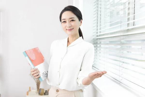 Asian Korean female psychiatric doctor in clinic