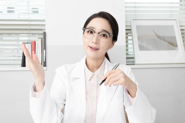 Asian Korean female psychiatric doctor in clinic