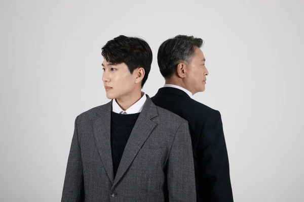 business concept Korean Asian old and young men opposing