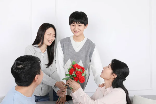 Asian Korean Family Picture of carnations for parents